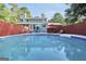Backyard pool with lounge chairs and umbrellas, perfect for outdoor relaxation and entertaining at 437 Mays Rd, Stockbridge, GA 30281