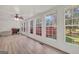 Bright sunroom with ample windows, shiplap walls, and modern ceiling fan at 437 Mays Rd, Stockbridge, GA 30281
