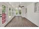 Bright sunroom with ample windows, shiplap walls, and modern ceiling fan at 437 Mays Rd, Stockbridge, GA 30281