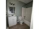 This bathroom features a standard white vanity with a tub-shower combination at 2884 Haddon Dr, Rex, GA 30273