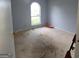 Bedroom featuring neutral walls, carpet, and a bright window at 2884 Haddon Dr, Rex, GA 30273