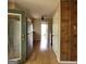 Bright hallway that provides convenient access to kitchen featuring stainless steel fridge at 2884 Haddon Dr, Rex, GA 30273