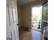 Functional area with access to the outdoors, featuring wood-look flooring and utility connections at 2884 Haddon Dr, Rex, GA 30273