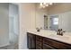 Modern bathroom featuring a double vanity with dark wood cabinets and a large mirror at 315 Westfall Ter # 226A, Loganville, GA 30052