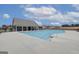 View of a refreshing community pool with pool house, and nearby neighborhood residences at 315 Westfall Ter # 226A, Loganville, GA 30052