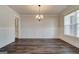 Formal dining room with wainscoting, hardwood floors, and ample natural light at 315 Westfall Ter # 226A, Loganville, GA 30052