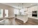 Gourmet kitchen with granite countertops, stainless steel appliances, and hardwood floors at 315 Westfall Ter # 226A, Loganville, GA 30052