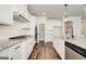 Gourmet kitchen with granite countertops, white cabinets, and stainless steel appliances at 315 Westfall Ter # 226A, Loganville, GA 30052