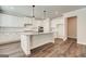 Modern kitchen with granite countertops, stainless steel appliances, and a large island at 315 Westfall Ter # 226A, Loganville, GA 30052