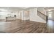 Open floor plan with hardwood floors, a staircase, and a gourmet kitchen at 315 Westfall Ter # 226A, Loganville, GA 30052
