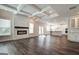 An open concept living space with hardwood floors, a fireplace, coffered ceilings, and a gourmet kitchen at 315 Westfall Ter # 226A, Loganville, GA 30052