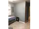 A cozy space with ceramic tile flooring, grey walls and window at 821 Beckwith Sw St, Atlanta, GA 30314