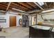Utility basement with pegboard walls, featuring plumbing, lighting and exposed ceiling at 3498 Overland Trl, Ellenwood, GA 30294