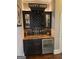 Stylish bar area with granite countertop and beverage cooler at 2643 Edgewater Ct, Jonesboro, GA 30236