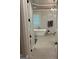 Bathroom with freestanding tub, marble tile and modern fixtures at 2643 Edgewater Ct, Jonesboro, GA 30236