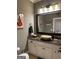 Stylish bathroom features a vessel sink, granite countertop, and decorative mirror at 2643 Edgewater Ct, Jonesboro, GA 30236