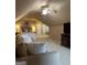 Spacious bedroom boasts a comfortable couch, soft lighting, and a ceiling fan at 2643 Edgewater Ct, Jonesboro, GA 30236
