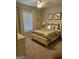 Cozy bedroom features carpet, a ceiling fan, and a bright window at 2643 Edgewater Ct, Jonesboro, GA 30236