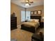 Comfortable bedroom with neutral carpet, ceiling fan, and natural light at 2643 Edgewater Ct, Jonesboro, GA 30236