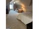 Spacious bedroom with sloped ceilings, a cozy couch, and natural light at 2643 Edgewater Ct, Jonesboro, GA 30236