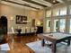 Elegant dining room with hardwood floors, pool table and lake view at 2643 Edgewater Ct, Jonesboro, GA 30236