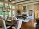 Elegant dining room with hardwood floors, fireplace and lake view at 2643 Edgewater Ct, Jonesboro, GA 30236