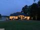 Exterior of home at twilight featuring manicured landscaping and large front yard at 2643 Edgewater Ct, Jonesboro, GA 30236
