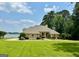 Expansive single-story home with beautiful lawn and lake views at 2643 Edgewater Ct, Jonesboro, GA 30236