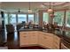 Open concept kitchen with stainless steel appliances, dark counters and eat in bar facing lake at 2643 Edgewater Ct, Jonesboro, GA 30236