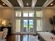 Bright, airy living room with lake view through the french doors at 2643 Edgewater Ct, Jonesboro, GA 30236