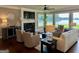 Inviting living room featuring a fireplace, comfortable seating, and views of the lake at 2643 Edgewater Ct, Jonesboro, GA 30236