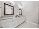 Beautiful bathroom showcasing dual sinks, gray counters, framed mirrors, and modern fixtures at 1094 Township Sq, Alpharetta, GA 30022