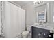 Bathroom featuring a vanity, toilet, and shower/tub combo with clean, white design at 1094 Township Sq, Alpharetta, GA 30022