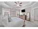 Large bedroom with natural light, a ceiling fan, wood dresser, and ample space for furniture at 1094 Township Sq, Alpharetta, GA 30022