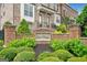 Elegant brick entrance sign for The Towns at East Village with beautiful landscaping at 1094 Township Sq, Alpharetta, GA 30022
