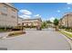 Welcoming entrance gate to the townhome community, showcasing well-maintained landscaping at 1094 Township Sq, Alpharetta, GA 30022