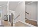 Inviting entryway with hardwood floors, staircase, and elegant trim, leading to a bright interior at 1094 Township Sq, Alpharetta, GA 30022