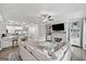 Spacious living area open to the kitchen, featuring a fireplace, sofa, and modern décor at 1094 Township Sq, Alpharetta, GA 30022