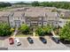 Beautiful townhomes featuring brick exteriors, well-manicured lawns, and convenient parking at 1094 Township Sq, Alpharetta, GA 30022