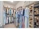 Organized walk-in closet with ample shelving and hanging space for clothes and accessories at 1094 Township Sq, Alpharetta, GA 30022