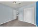 Bedroom with plush carpet, a built-in closet, and soothing light blue walls at 136 Glynn Addy Dr, Stockbridge, GA 30281