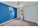 Cozy bedroom with neutral carpet, light blue walls, and ample natural light at 136 Glynn Addy Dr, Stockbridge, GA 30281