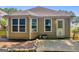 Back of home featuring a backyard with an exterior door and windows at 136 Glynn Addy Dr, Stockbridge, GA 30281