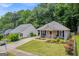 Inviting single-story home with meticulous landscaping, and a quaint front porch at 136 Glynn Addy Dr, Stockbridge, GA 30281
