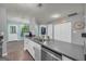 Well-lit kitchen featuring stainless steel appliances, shaker cabinets, and a seamless transition to the adjacent room at 136 Glynn Addy Dr, Stockbridge, GA 30281
