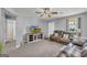 Cozy living room with a TV, carpeted floors, and comfortable seating for relaxation at 136 Glynn Addy Dr, Stockbridge, GA 30281