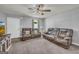 Comfortable living room boasts neutral walls, plush seating, and ample natural light at 136 Glynn Addy Dr, Stockbridge, GA 30281
