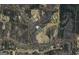Aerial view depicting property lines and surrounding land, with roads and neighborhood features visible at 1561 Aiken Chafin Ln, Mcdonough, GA 30252