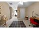 Well-lit bedroom featuring an office area, neutral carpet, and large windows at 1561 Aiken Chafin Ln, Mcdonough, GA 30252