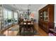 Charming dining room with a hutch, wood floors, and large windows for natural light at 1561 Aiken Chafin Ln, Mcdonough, GA 30252